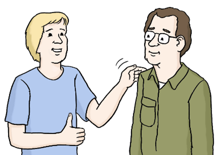 Zwei Personen sind auf dem Bild. Die Person links redet und zeigt einen Daumen hoch. Ihre andere Hand klopft dem anderen Mann auf die Schulter. Der lächelt leicht.